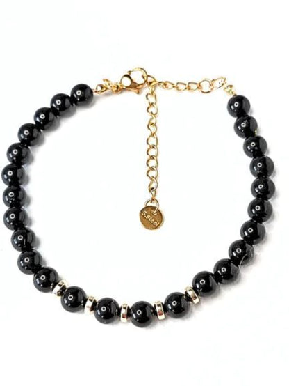 Pulsera de piedra Turmalina y detalles dorados